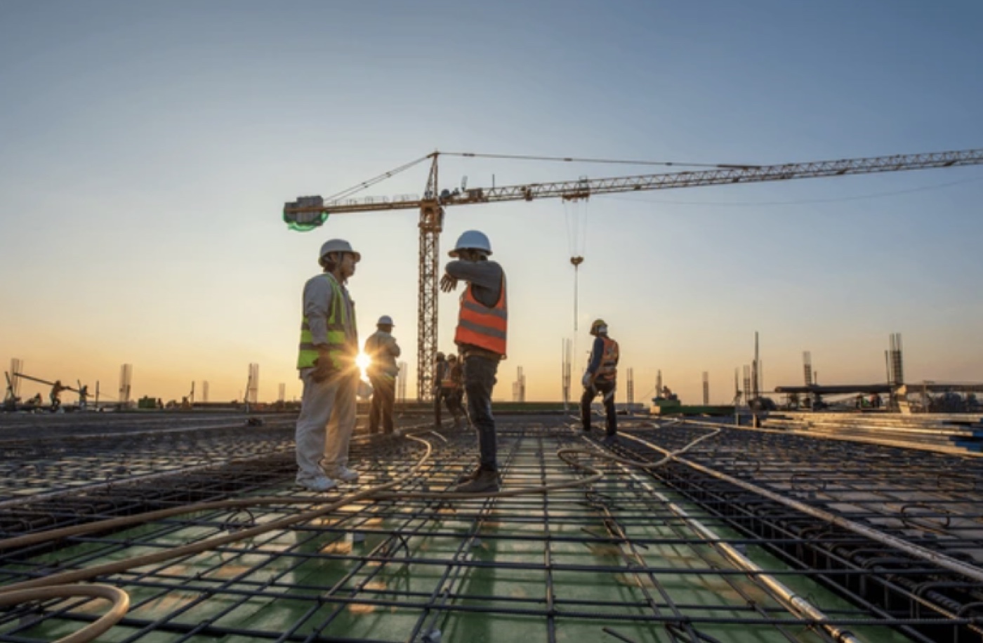 Deschy Constructions crew working on a build site at dusk